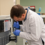 Dr. Steven Hrycaj stains a slide in the IHC Laboratory